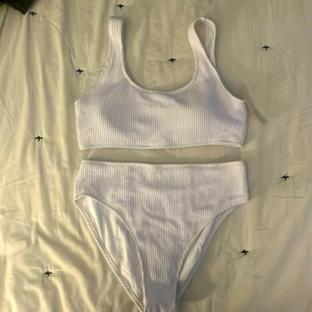 Woman’s white two piece suit. Brand new, never worn